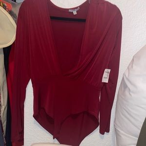 Never worn- still has Tags Women body Suit